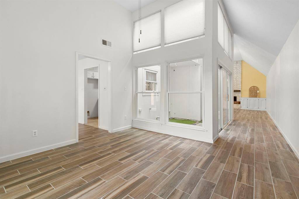 This is the dining room but would make a perfect home office with so much natural lighting and high ceilings.