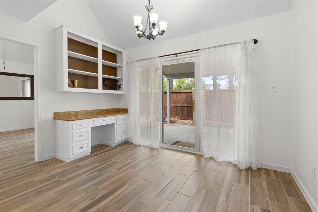 The breakfast room is just off the kitchen and leads to the back patio as well. Notice all the lighting in the home has been updated as well