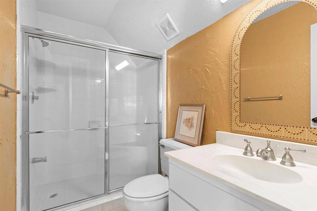 This ensuite bath has updated fixtures and a walk in shower