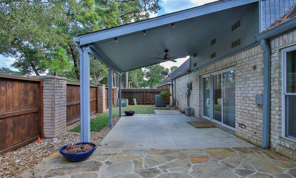 You'll love spending time on this spacious patio! It's extended on one side with flag stone.