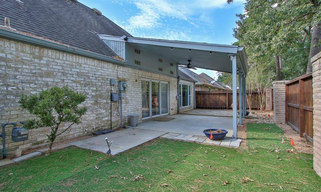 Another view showing the back yard and patio