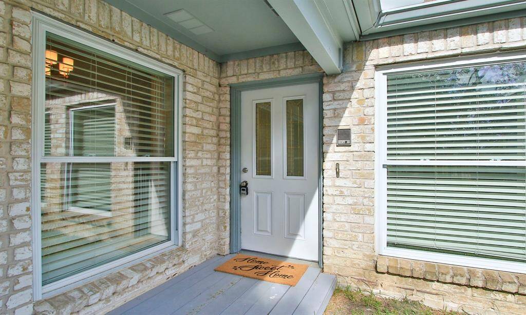 The front entry is covered and behind you is the personal door to the garage. So you can get from the garage to the home without having to get in the weather.