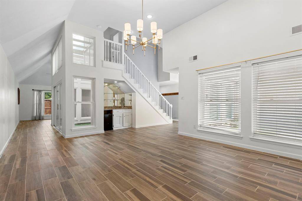 Looking back as you stand at the fireplace. Upstairs is the 3rd and bedroom and full bath.