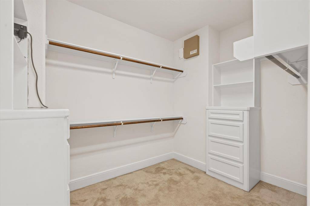 Huge primary closet with multiple built ins!
