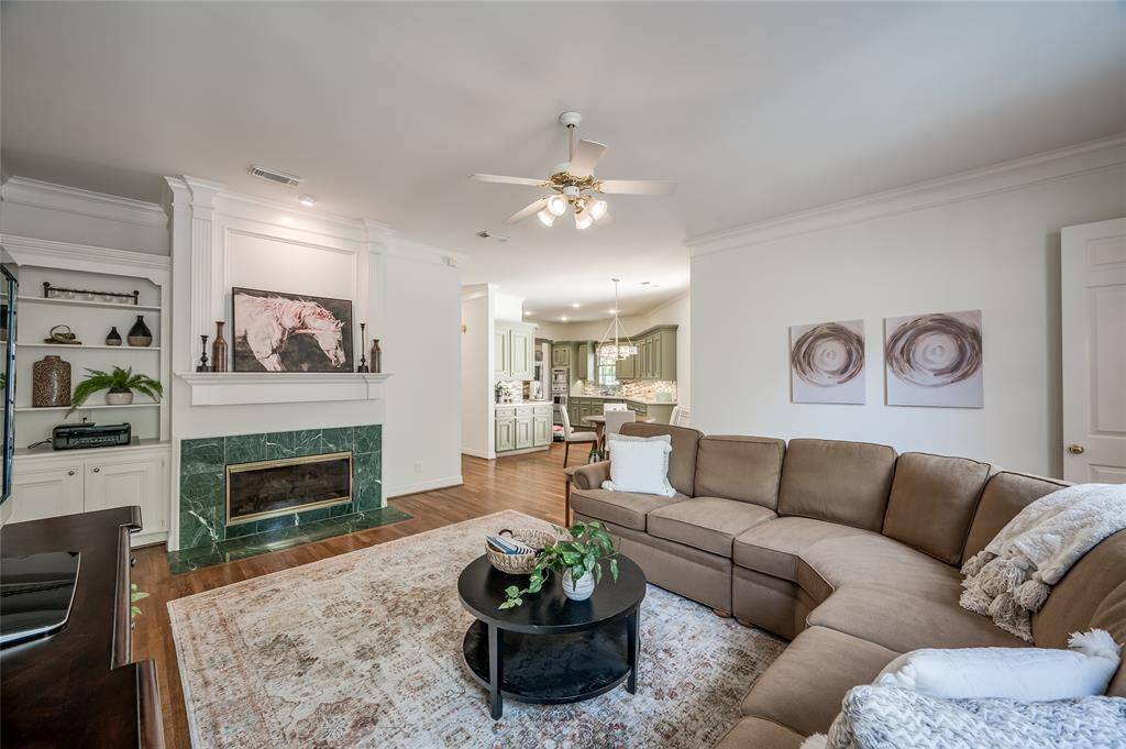 Cozy up by the gas log fireplace in the inviting family room.