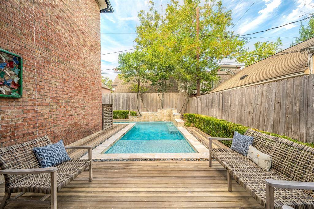Imagine sunny days of indoor-outdoor living with a private deck, sparkling pool, and a fully-equipped outdoor kitchen just off the family room.