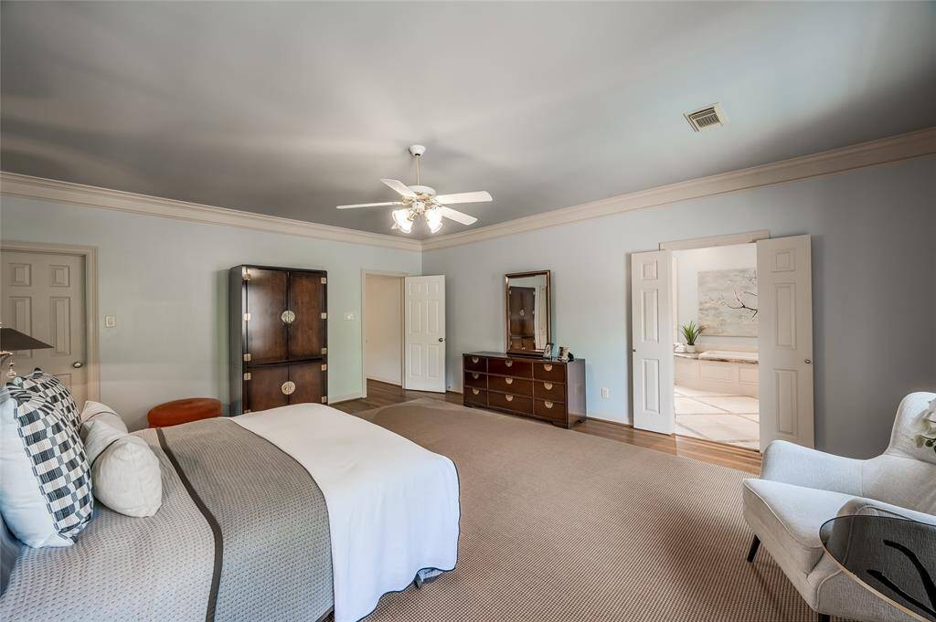 The oversized primary suite has the luxury of two well designed walk-in closets, including one in the primary bath.