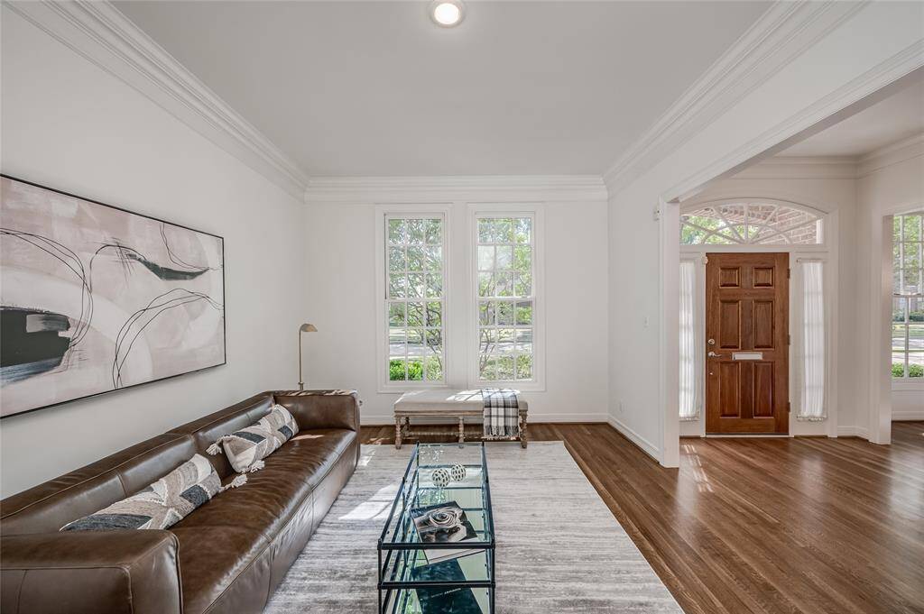 Welcome guests to this bright, inviting living area just off the entrance.