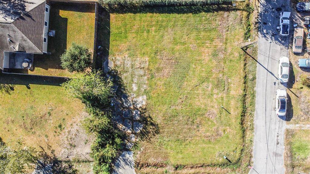 Aerial view of lots.  Bottom of photo represents north side of property. Right side street is Sam Wilson.