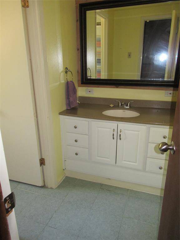 Full bath in home is functional with this space for the sink being separate from the tub and toilet.