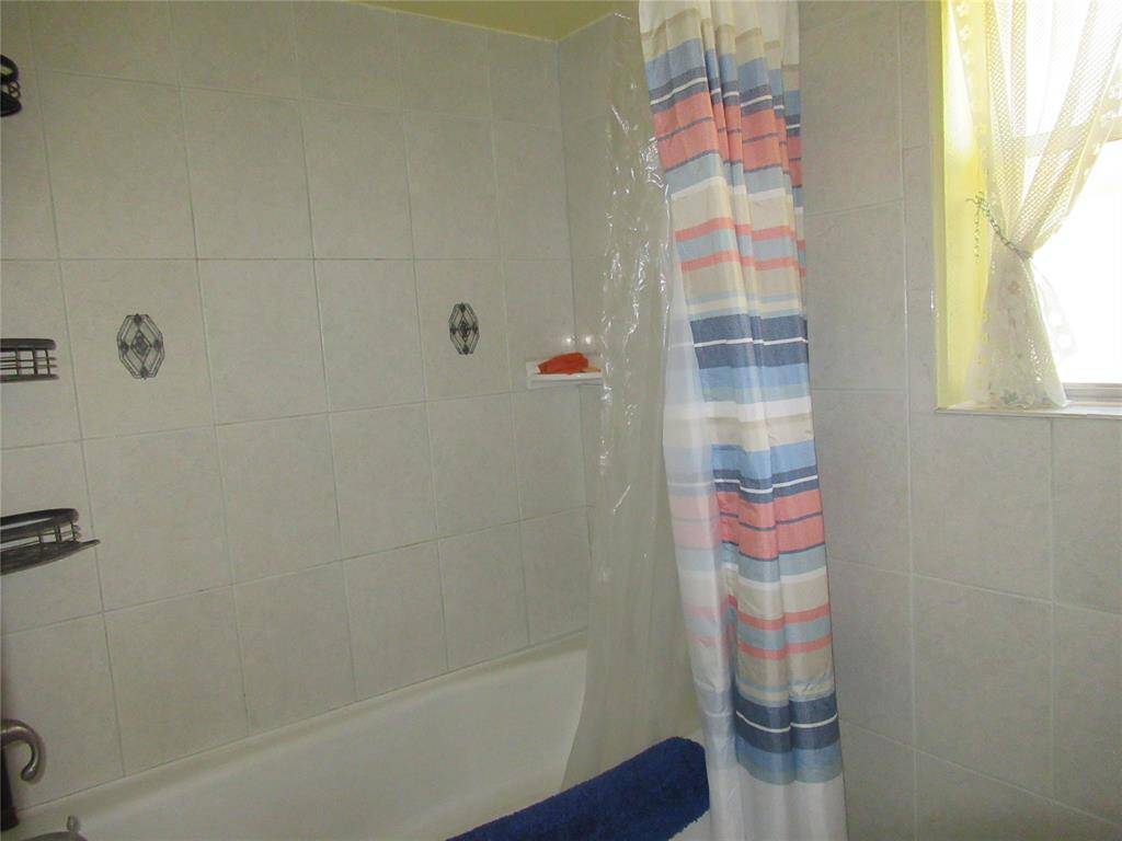 Showing shower and tub in the home.