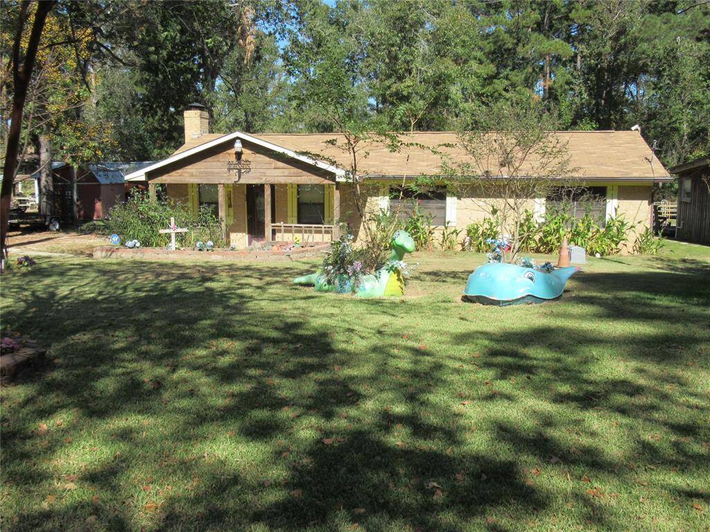 This home lives large with plenty of space for heads in beds and toys in the drive.