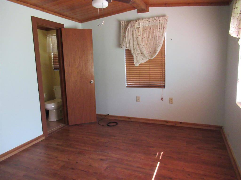 Primary bedroom has a half bah attached. See it to left in this pic.