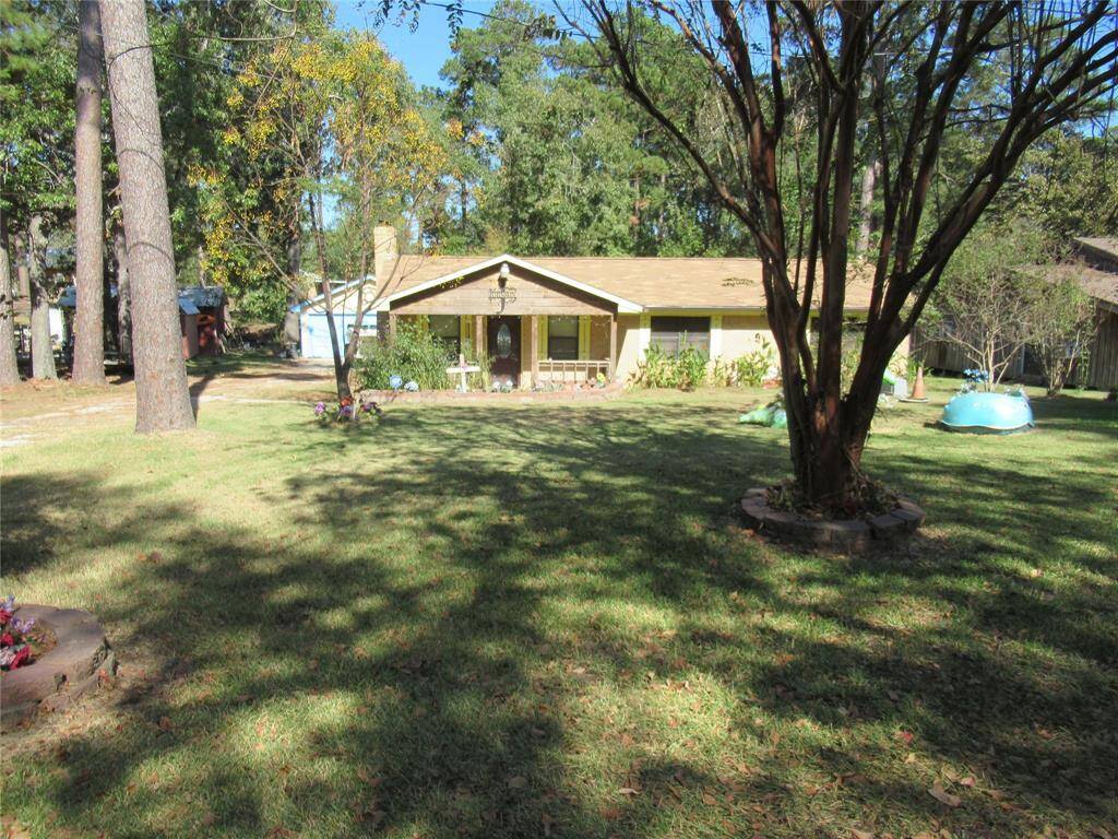 Showing the spacious front yard with all the shade.