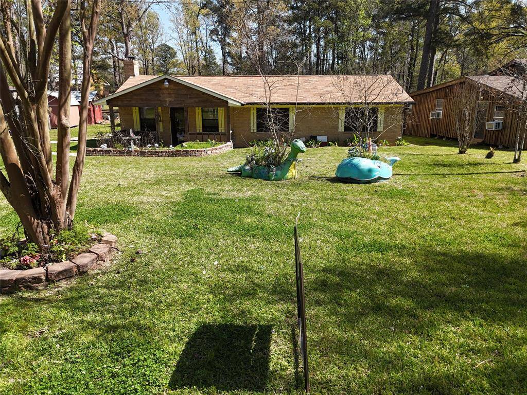 Whimsical front yard will welcome you home.
