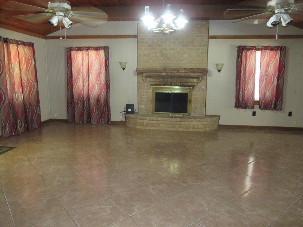 On opposite wall from entry door is the cozy fireplace.