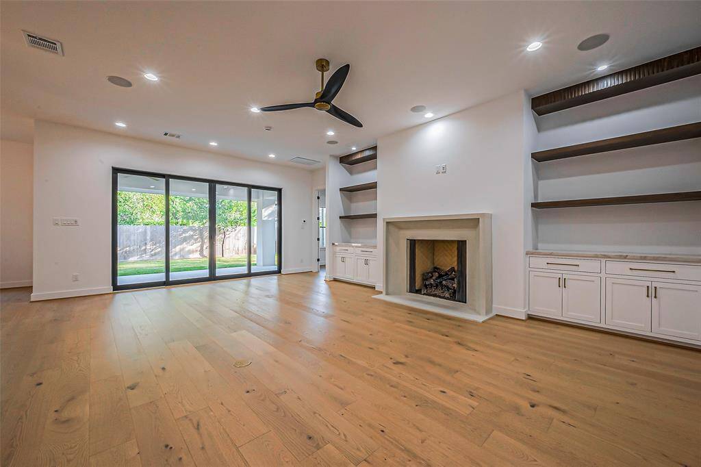 Spacious living room with gas and wood burning fireplace