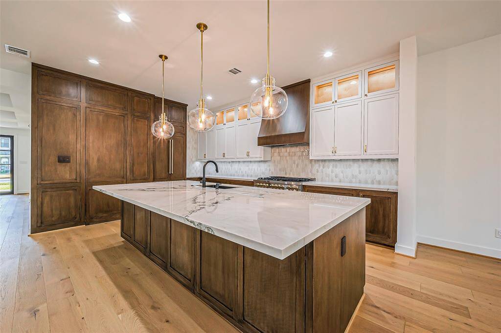 Kitchen- with quartzite countertop and rift sawn white oak cabinetry