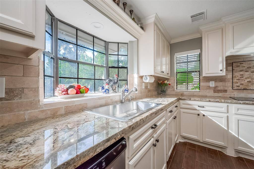 The multiple kitchen windows bring in tons of natural light!