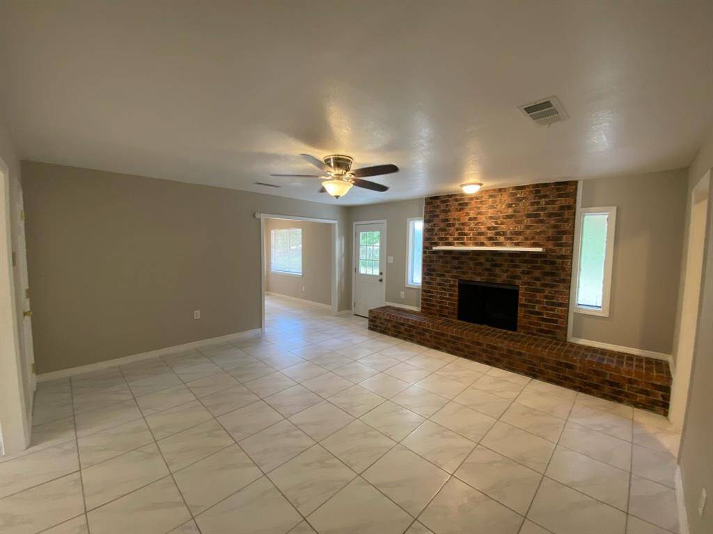 Den or family room with chimney.