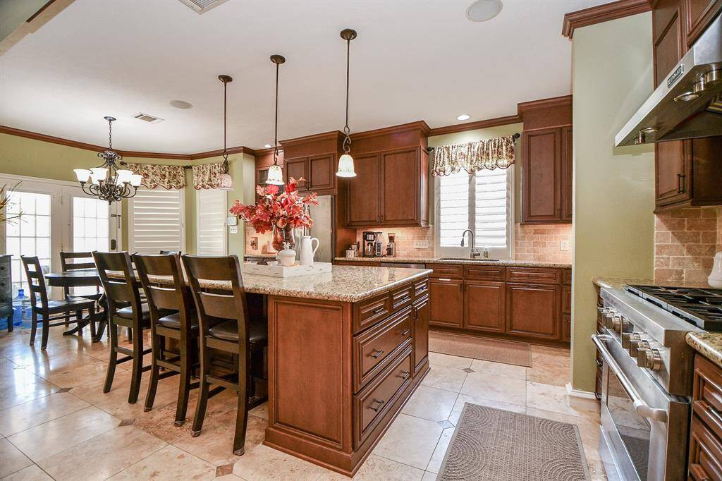 Abundant storage and open traveling room make this an exceptional place, with natural light everywhere, in addition to delicate pendant and chandelier lighting in the breakfast nook, left.