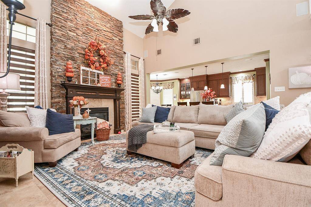 Serve food, and they will come in this glorious shared living/kitchen area.
