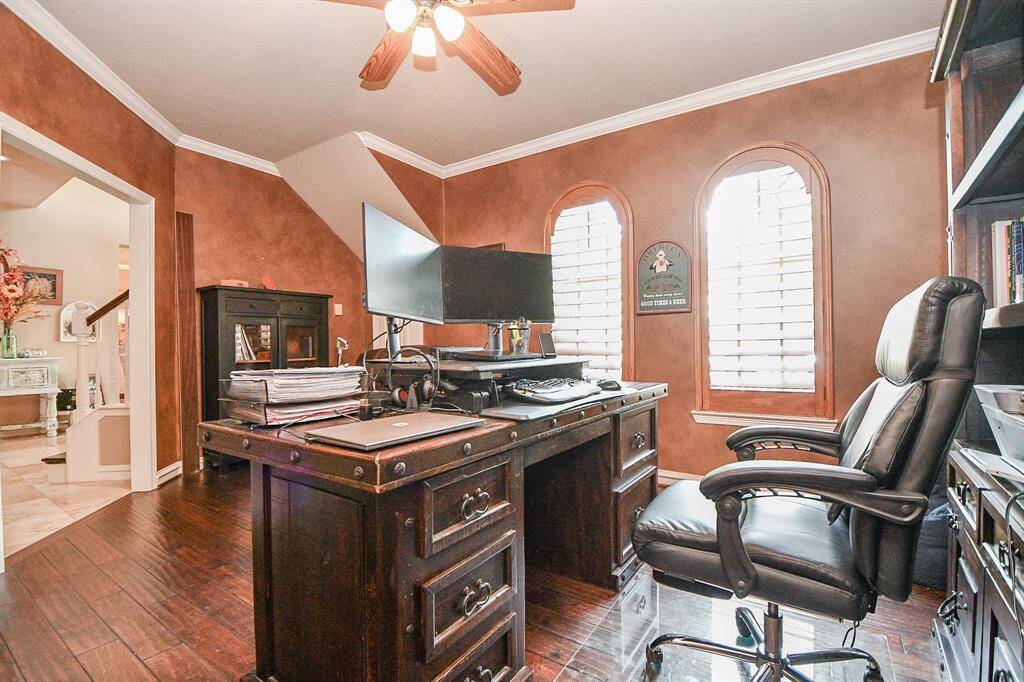 How grand is this home office right off the main entry hallway?