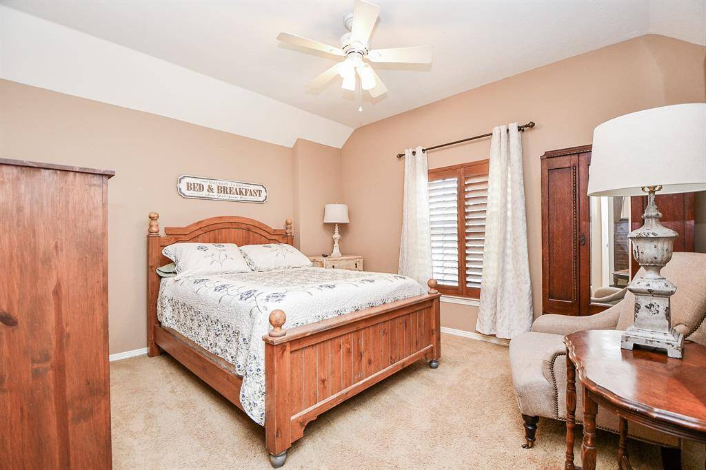 What a large, charming, carpeted secondary bedroom!