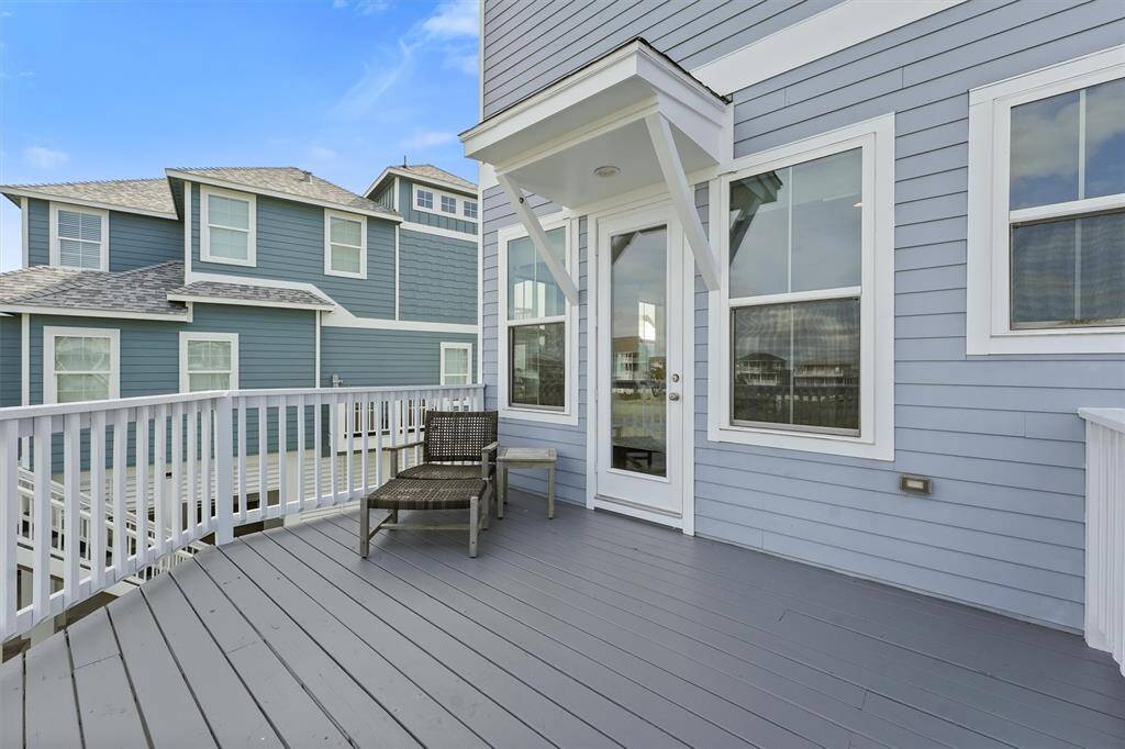 This spacious back deck offersthe perfect retreat for lounging,where you can sit back, relax,and enjoy the serene beachsideatmosphere.