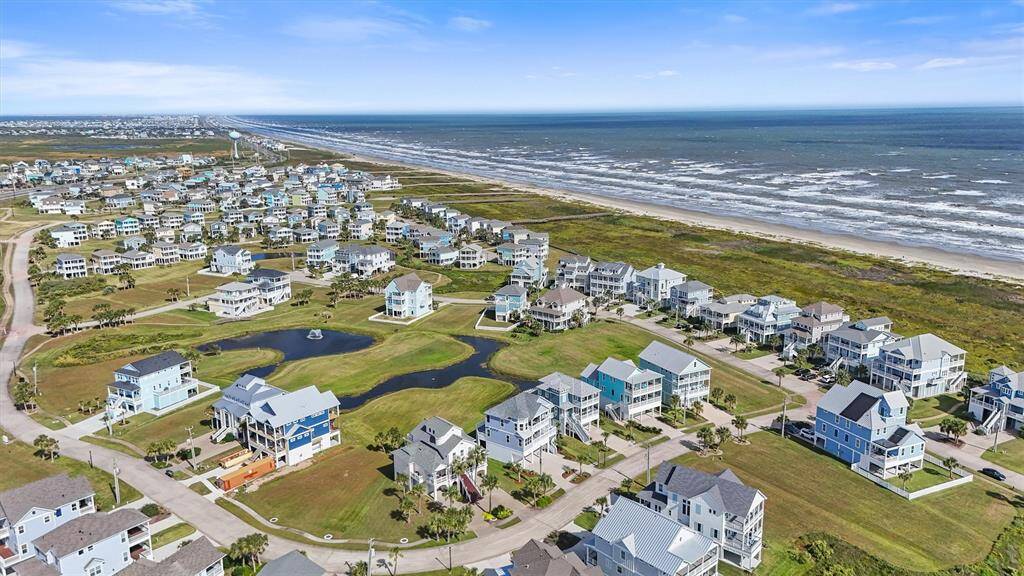 This breathtaking view showsthe neighborhood just steps fromthe pristine beaches of PointeWest, with the soothing sound ofthe waves and endless oceanviews.