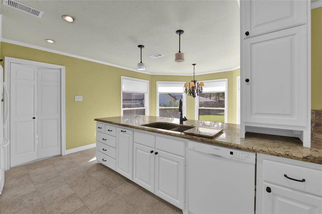 White cabinetry.... Granite... and lots of sunshine!