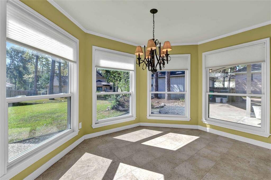 Sunny breakfast area has a fabulous view of the large fenced back yard.