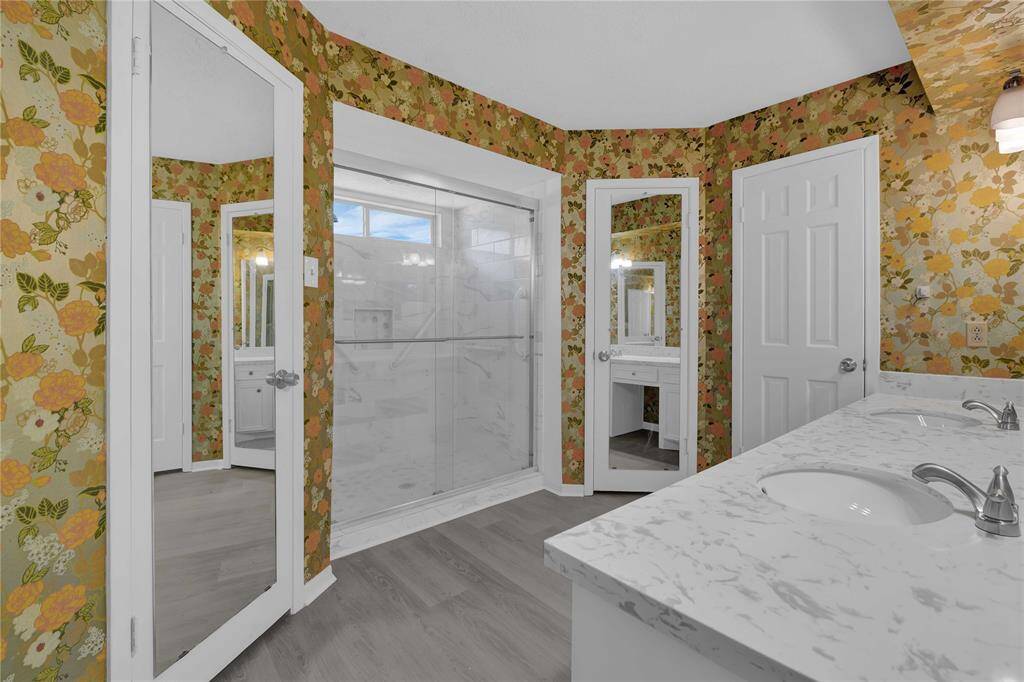 And... our updated bathroom off the primary bedroom... updated shower!