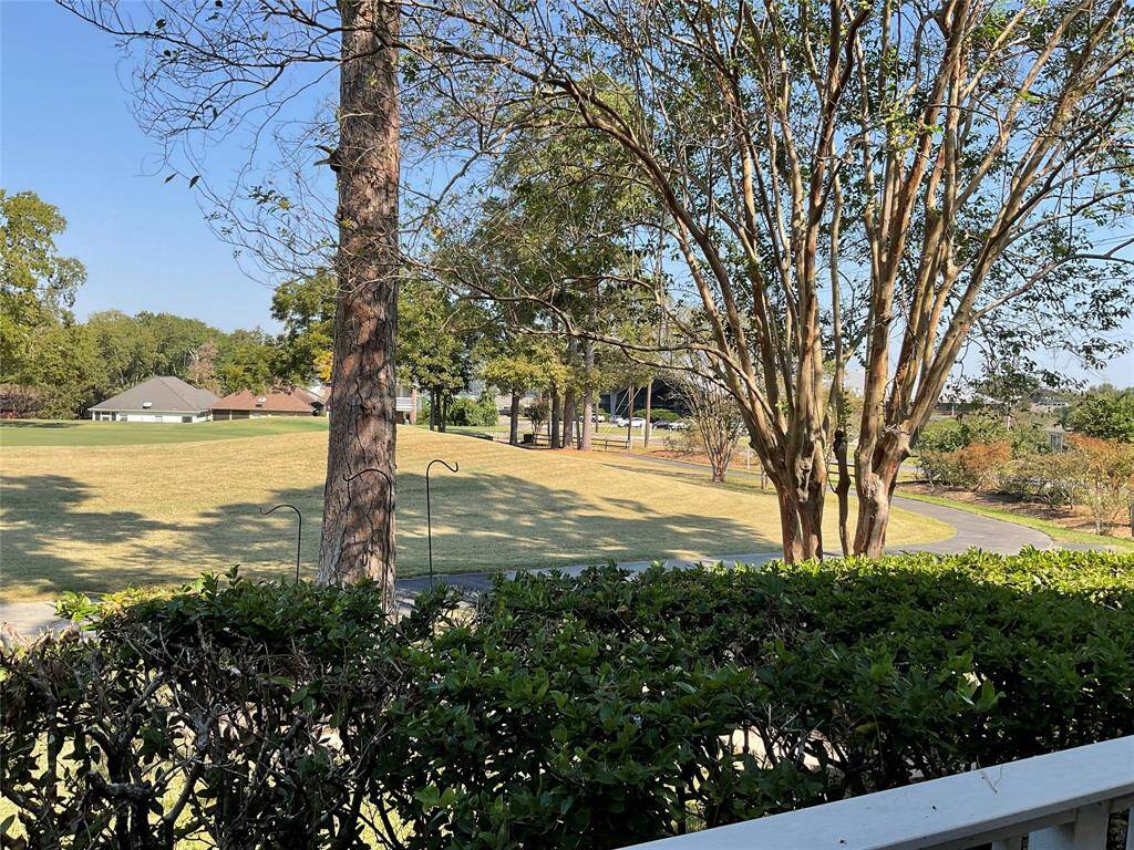 View from the back porch looking towards the golf course and tennis courts.
