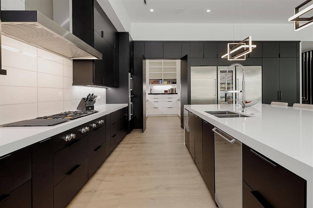 Kitchen features all Gaggenau stainless steel appliances, a 51" gas cooktop 5 burner w/grill & 63" vent hood, refrigerator, wine chiller, freezer double oven, dishwasher, microwave, built-in coffee maker.