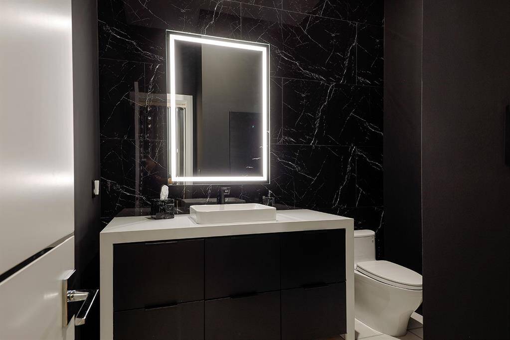 All bathrooms have lighted mirrors all vanities have waterfall sides with ample storage,