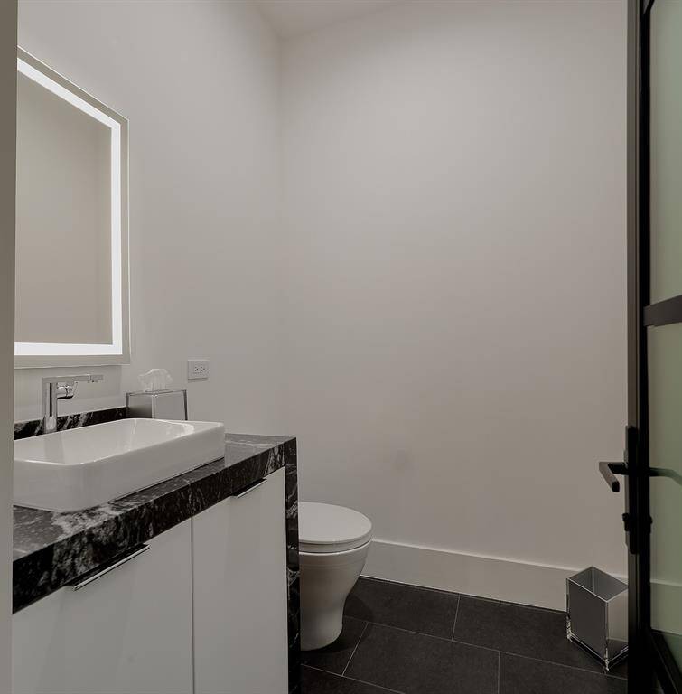 Another view of the second bedroom bathroom andlighted mirror.