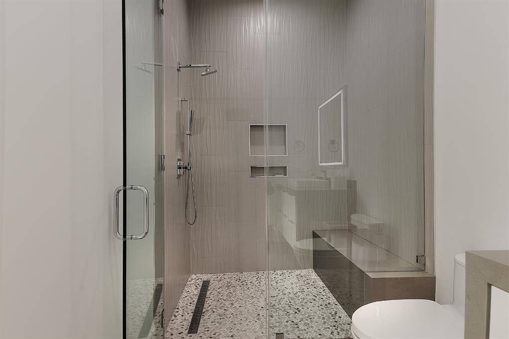 Ensuite bathroom featuring a spacious walk-in shower for bedroom 3.