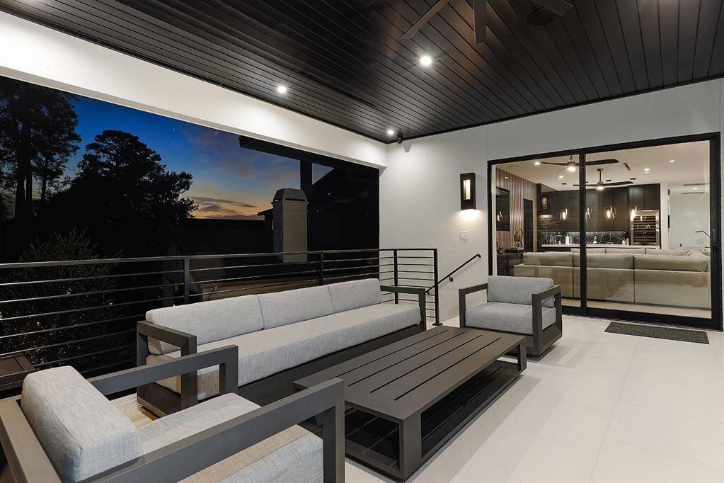 Another view of the game room Veranda.Samsung TV all weather wall mounted.