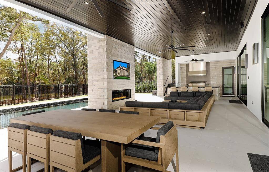 Another view of this amazing veranda and outdoor kitchen.  The door by the kitchen is an air conditioned pool bath.
