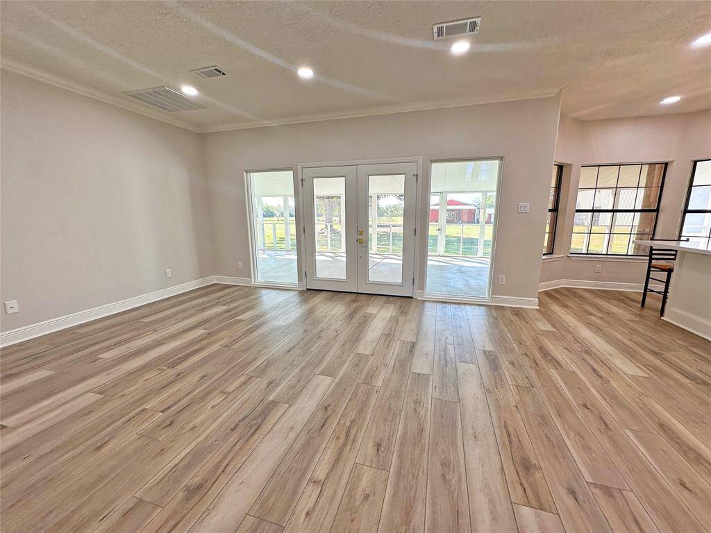 View of the family room towards the backyard with the “Barn” in the distance