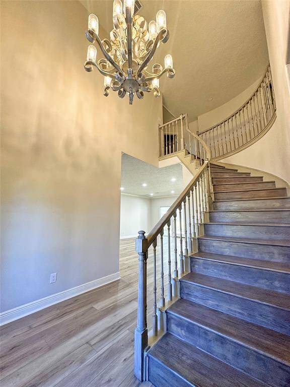 Beautiful Staircase and one of a kind chandelier