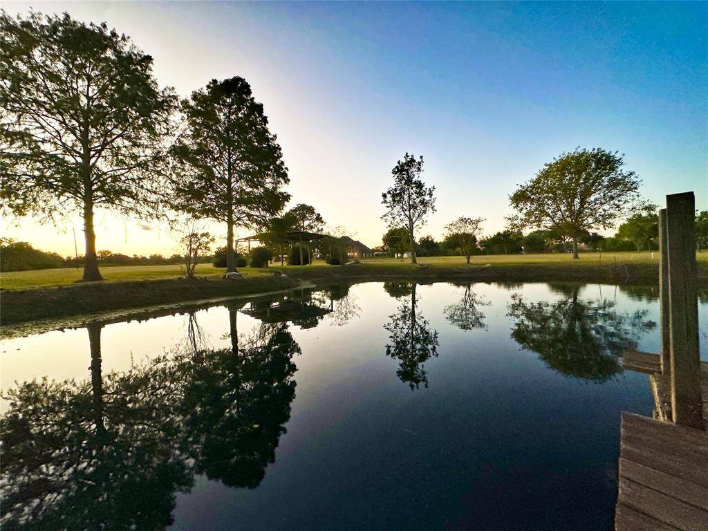 Pond with pier and covered area