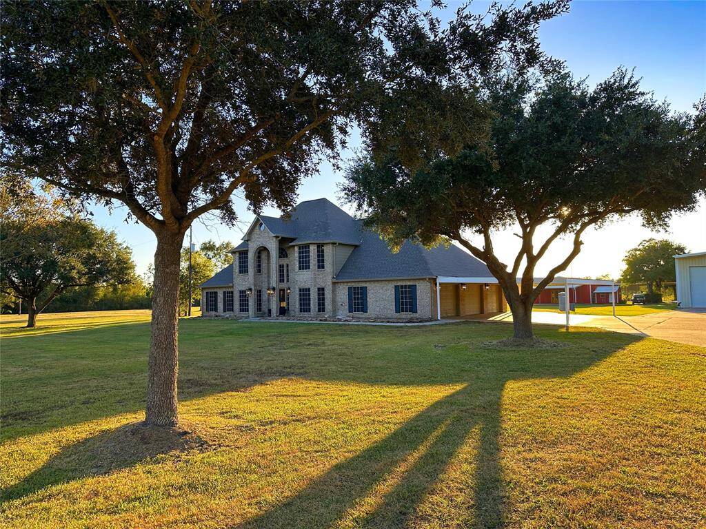 view as you approach your new home from the tree lined entry