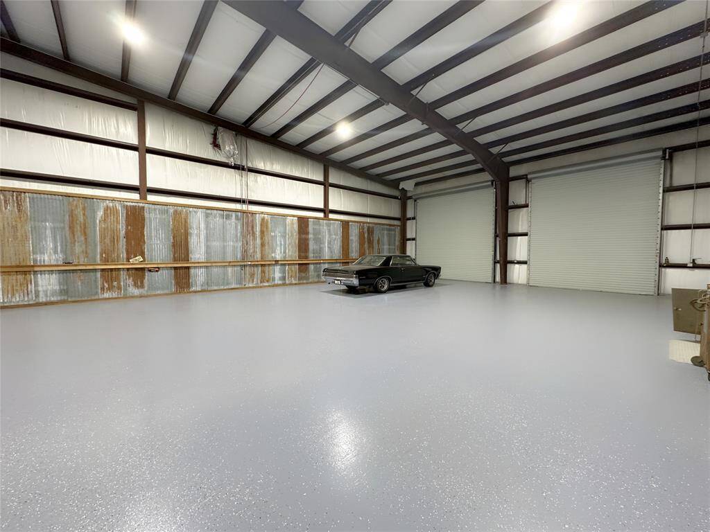 Back space in the main shop - custom flooring and high enough ceilings for volleyball, basketball, pickleball etc.