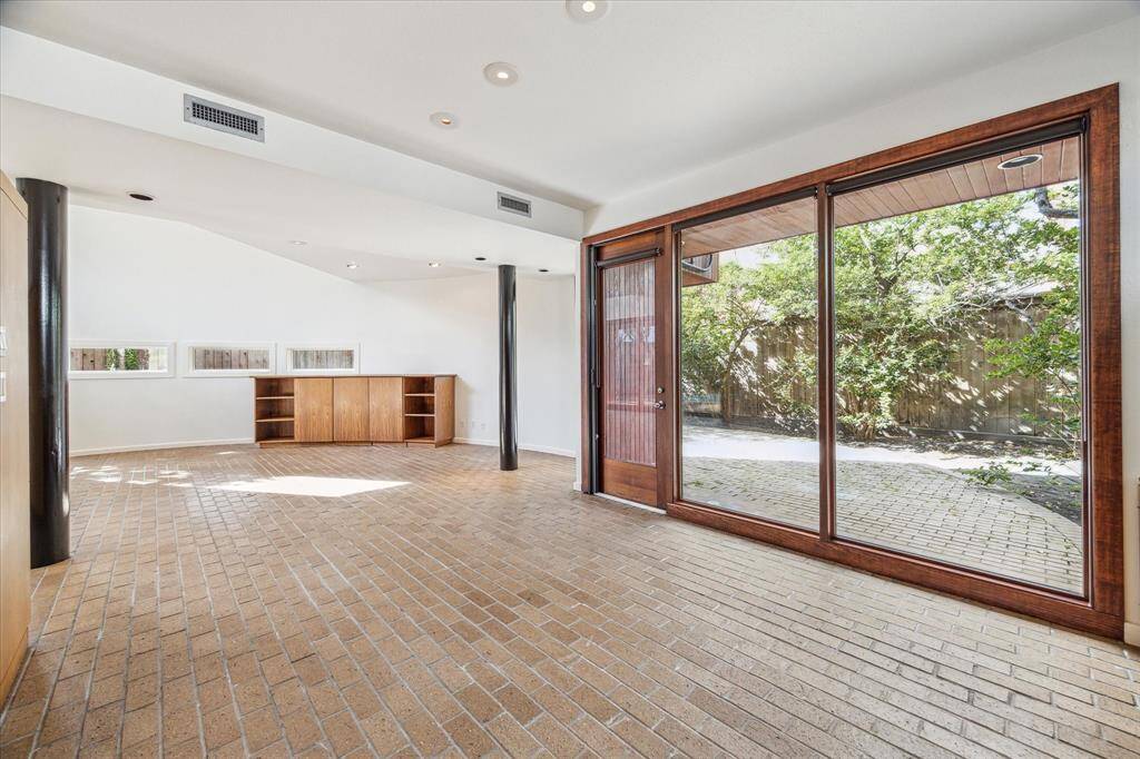 A view of the back patio from the dining room.  There aer brick pavers on the patio as there are at the front entrance to the home.