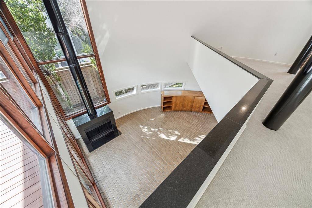 Looking down at the living room from the primary bedoom.