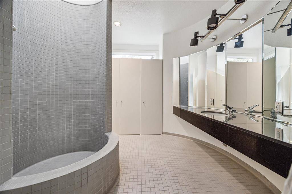 View of the tub/shower in one of the primary bathrooms.