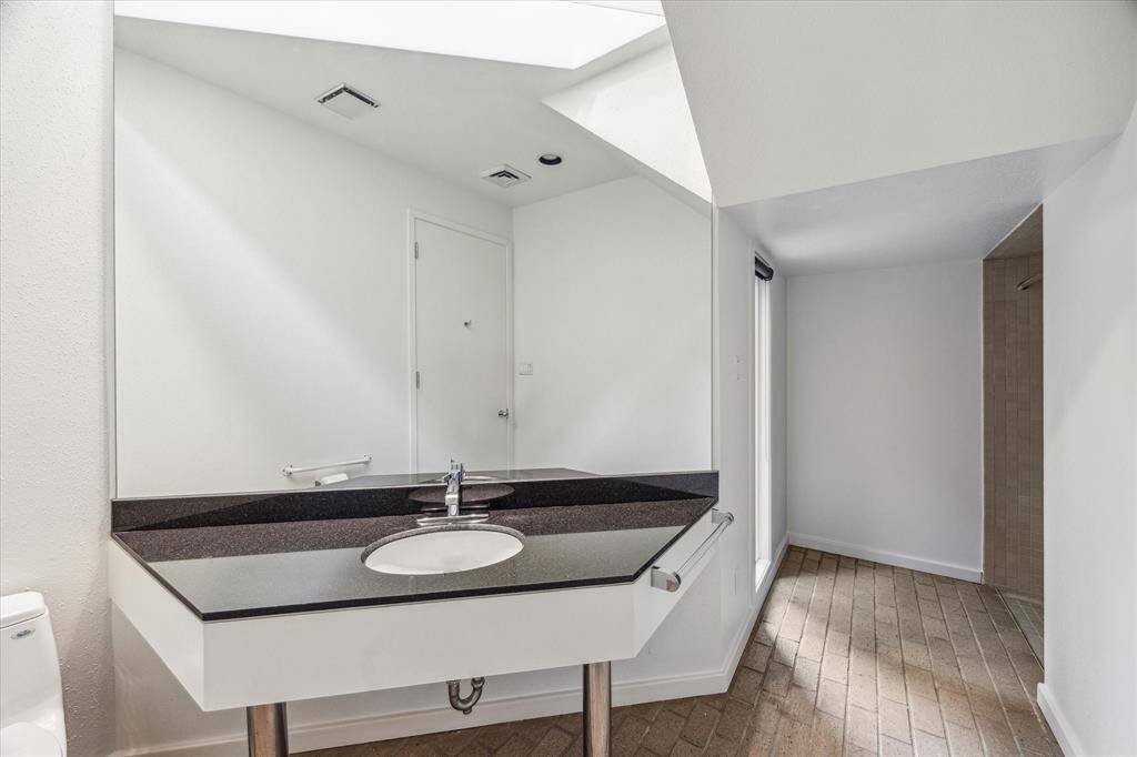 The downstairs powder room also has a shower to the right.