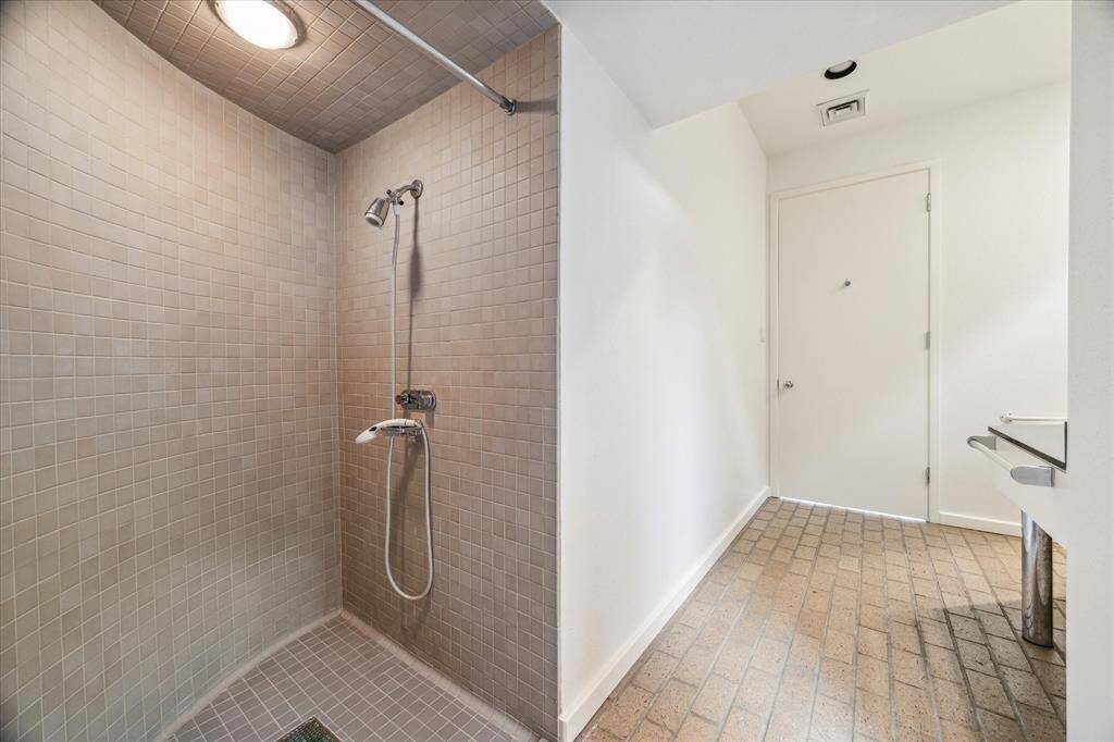 Downstairs shower in the powder room.